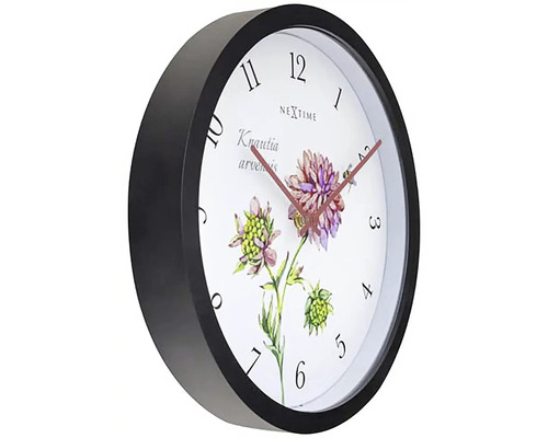 Nextime väggklocka med blommotiv och svart ram
