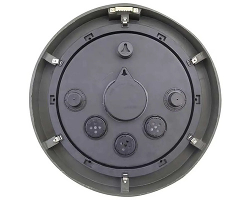 Baksidan av en rund väggklocka med fästelement