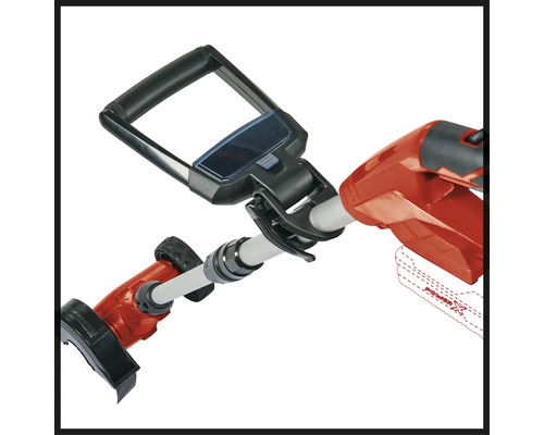 Detaljbild av en grästrimmer med handtag och batterianslutning