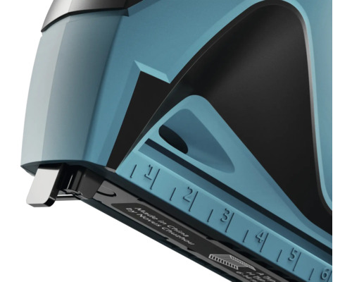 Detaljvy av en häftapparat med måttindelning