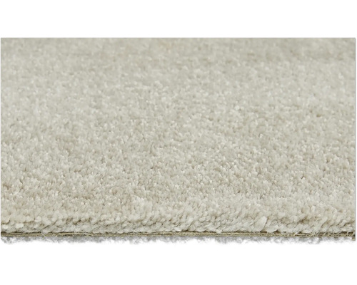 Detaljbild av en ljus matta med kort lugg