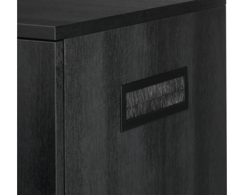 Detaljvy av ett svart kontorsskåp med kabelgenomföring