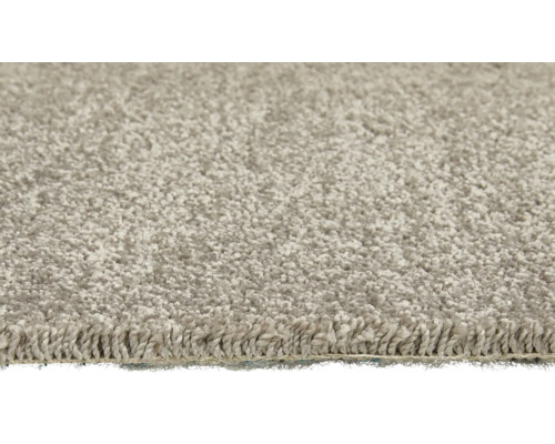 Närbild av en ljus matta med öglad struktur