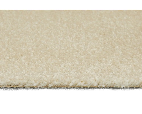 Detaljvy av en beige heltäckningsmatta