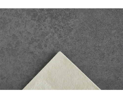 Utskuren bit av en non-woven tapet på en mörk bakgrund