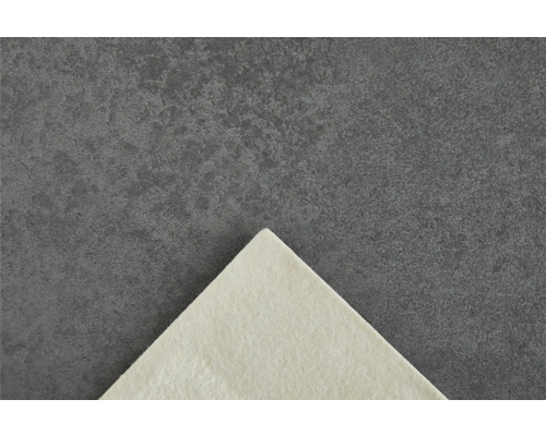 Detaljvy av ett ljust filtfoder på en mörk bakgrund