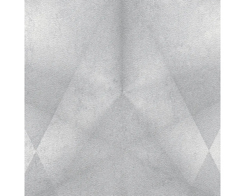 Närbild av en ljus vägg med geometriska mönster.