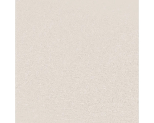 Detaljbild av en beige non-woven tapet