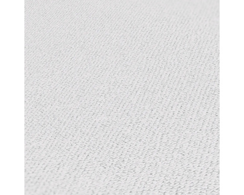 Närbild av ett vitt textilmaterial.