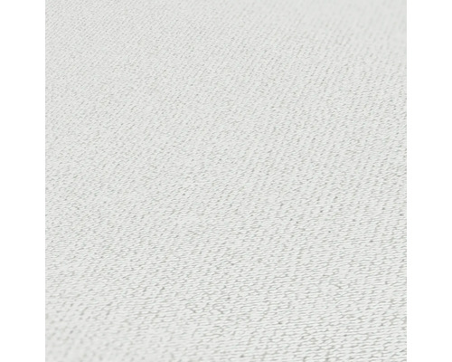 Närbild av ett strukturerat, ljust textilmaterial