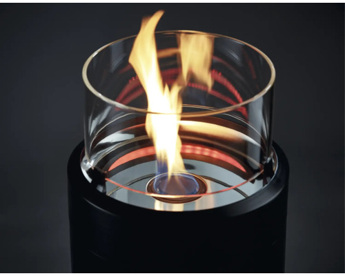 Bordskamin med glascylinder och flamma