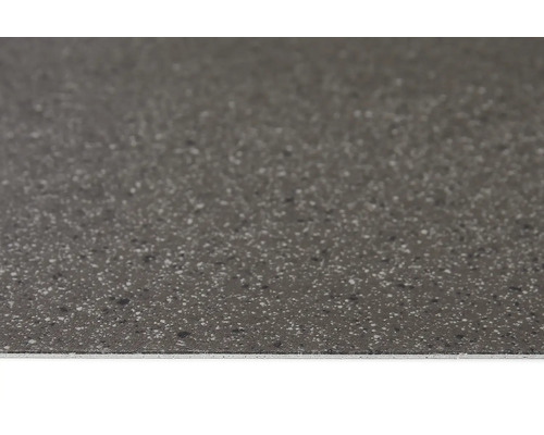 Närbild av en golvplatta med spräcklig textur