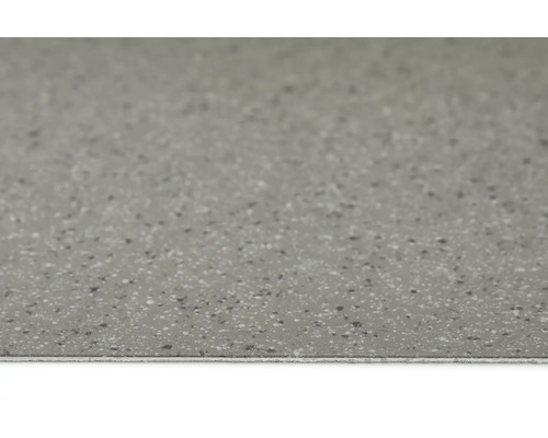 Grått golvkakel med fläckig yta