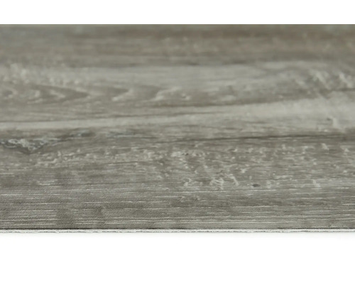 Närbild av ett vinylgolv med träutseende