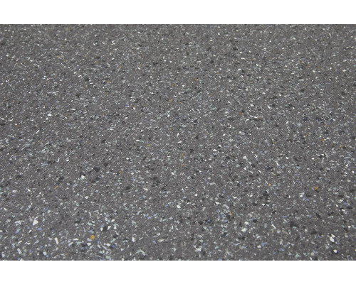 Närbild av en golvplatta med en fläckig finish