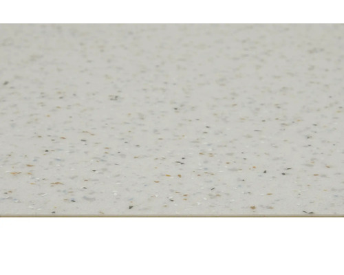 Närbild av en ljusfärgad bänkskiva med spräcklig design