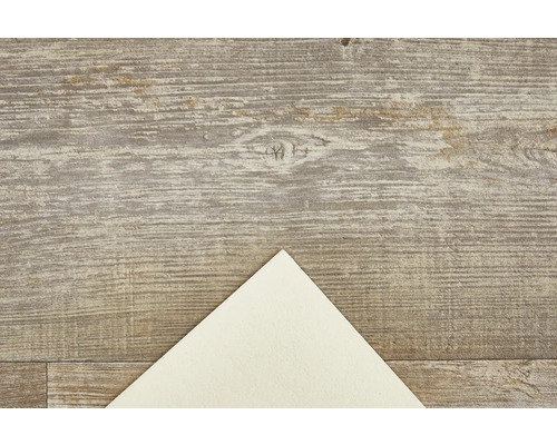 Dekorativ platta med trästruktur och ljust pappershörn