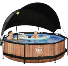 Rund pool med trädesign, soltak och lekande personer