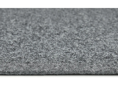 Närbild av en grå textilmatta