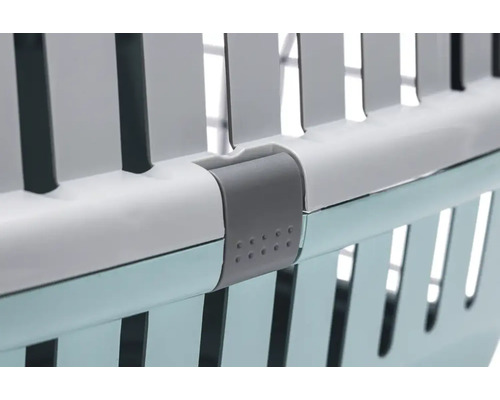 Detaljvy av en transportbur för djur med låsmekanism