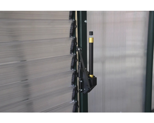 Detaljvy av en jalusidrivning för ett växthus