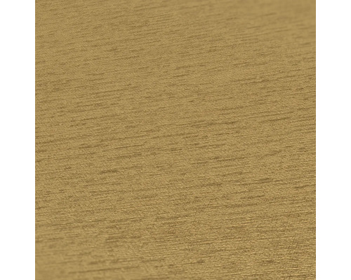 Närbild av en guldfärgad strukturtapet.