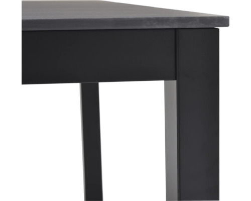 Detaljvy av ett bord med bordsskiva och bordsben