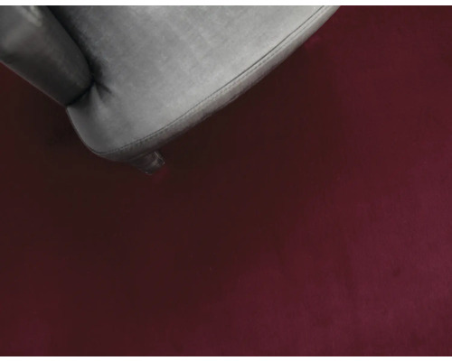 Närbild av en matta och ett stolsben