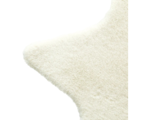 Detaljvy av en matta med pälsstruktur.