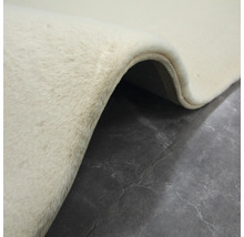 Detaljvy av en beige matta