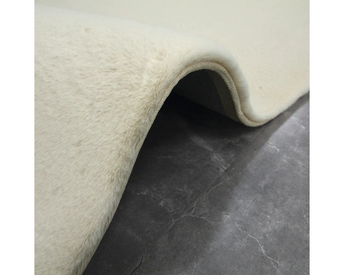 Detaljvy av en beige matta