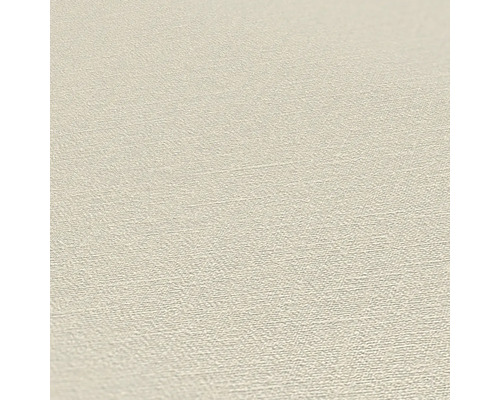 Närbild av en beige vinyltapet med lätt textur