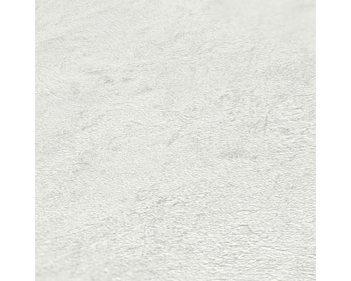 Närbild av en vit non-woven tapet med en lätt struktur