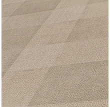 Närbild av en beige textilvägg med geometriskt mönster