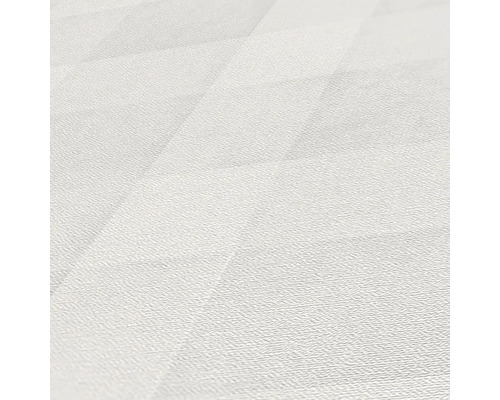 Detaljbild av ett ljust vinylgolv med geometriskt mönster