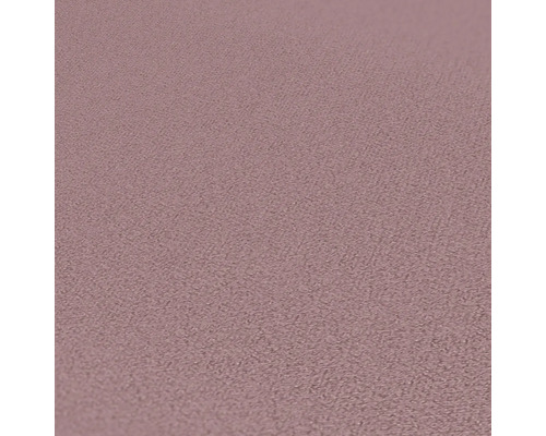 Närbild av en rosa textil tapet