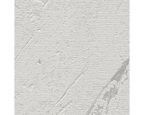 Närbild av en vit strukturtapet med reliefmönster