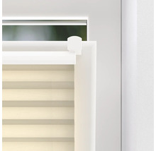 Detaljvy av ett fönster med en monterad plisségardin