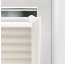 Detaljvy av en plisségardin på fönstret