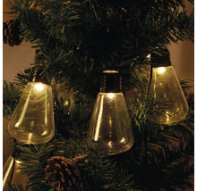 Dekorativ ljusslinga med glödlampor på en julgran