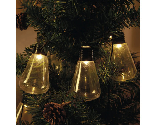 Dekorativ ljusslinga med glödlampor på en julgran