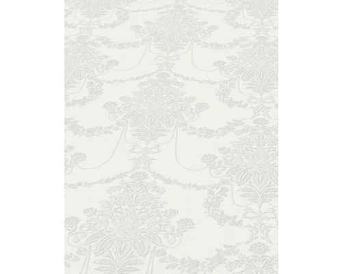 Närbild av en vit tapet med blommönster