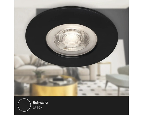 Svart infälld takspotlight i vardagsrum