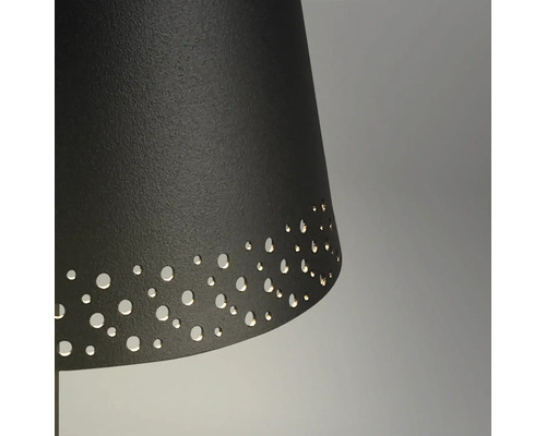 Detalj av en lampa med lampskärm och perforerat mönster