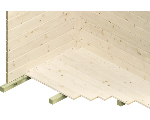 Detaljvy av trägolvet i ett trädgårdshus