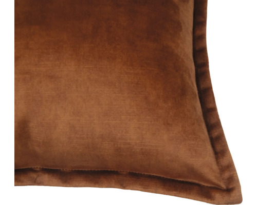 Närbild av en fyrkantig kudde i sammet