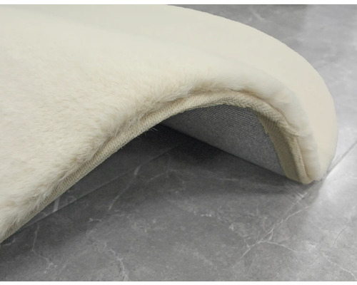 Detaljvy av en ljus matta med mjuk yta