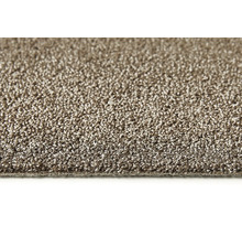 Närbild av en beige matta