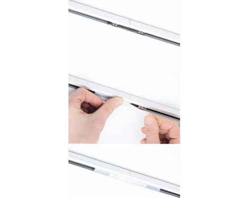 Detaljvy av en gardinskena under installationen.