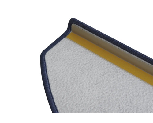 Detaljvy av en dörrmatta med textilyta